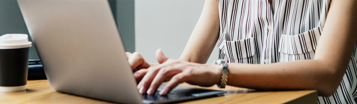 Woman typing on computer